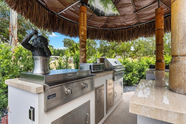 view of patio featuring exterior kitchen and area for grilling