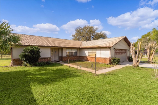 single story home featuring a front lawn and a garage