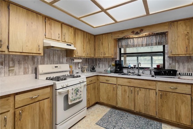 kitchen with sink and white range with gas cooktop