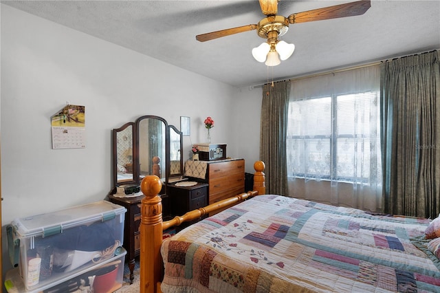 bedroom featuring a textured ceiling and ceiling fan