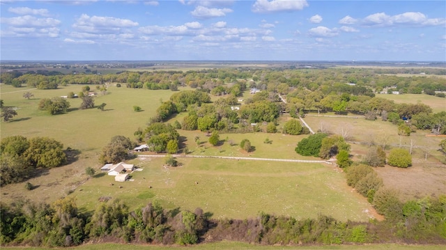 birds eye view of property with a rural view