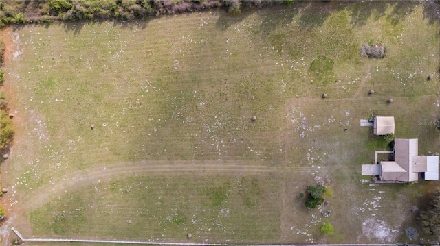 birds eye view of property with a rural view