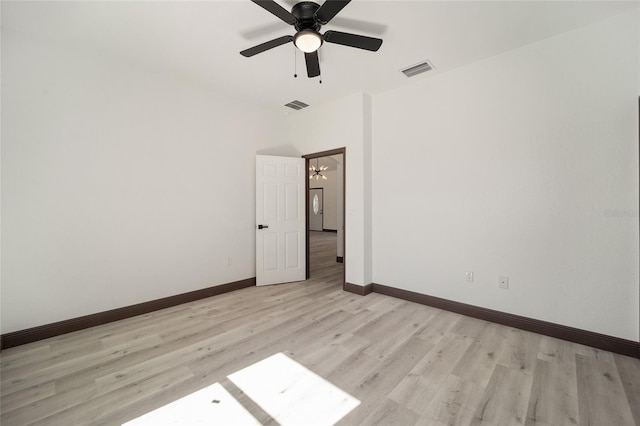 spare room featuring light wood-type flooring and ceiling fan