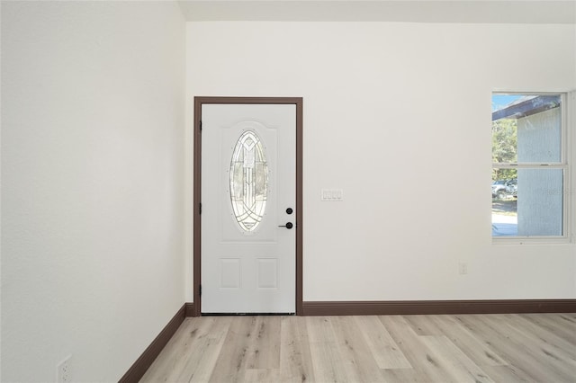 foyer entrance with light wood-type flooring