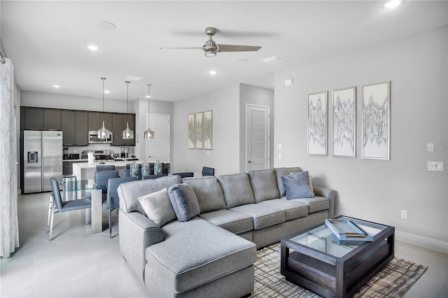 tiled living room with ceiling fan