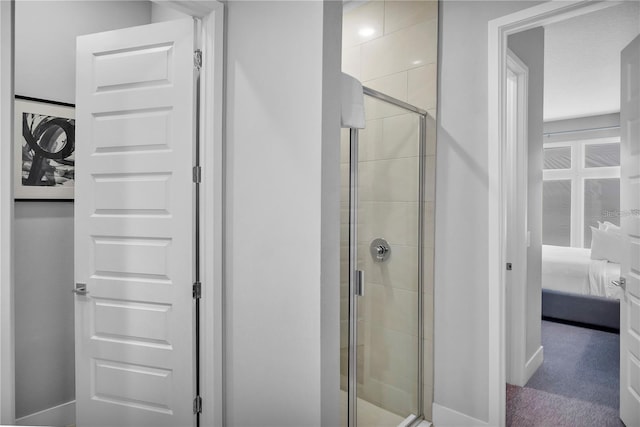 bathroom with a shower with shower door