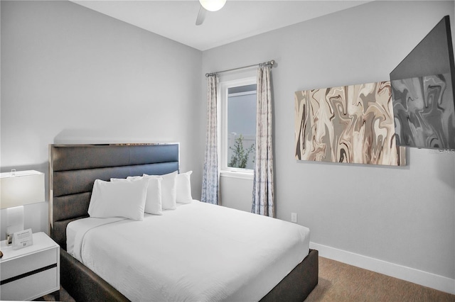 bedroom with ceiling fan and carpet floors