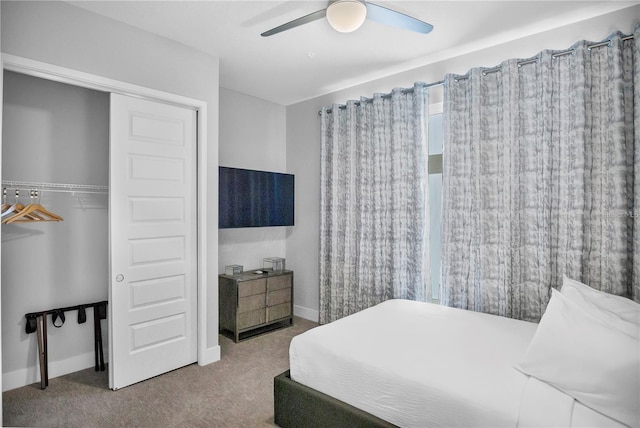 carpeted bedroom featuring a closet and ceiling fan