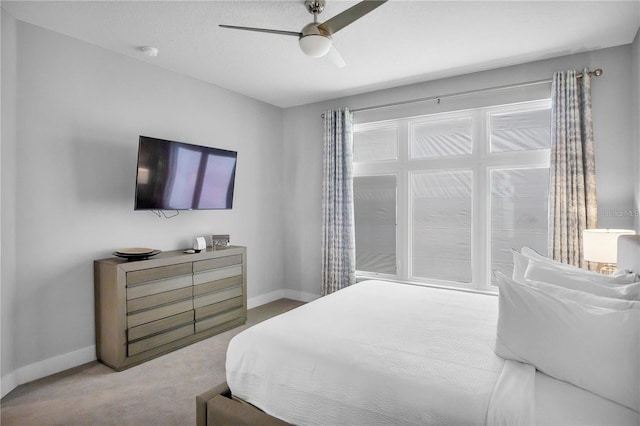 bedroom featuring ceiling fan and carpet floors