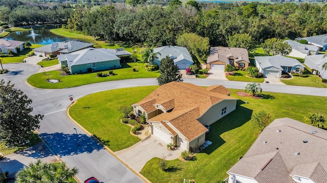 birds eye view of property with a water view