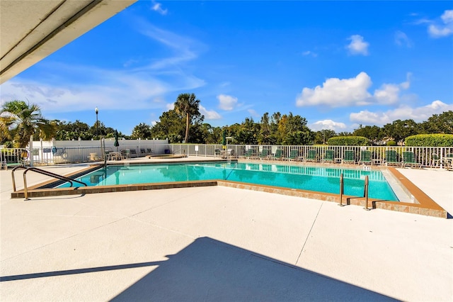 view of swimming pool featuring a patio