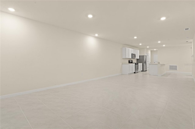 unfurnished living room with light tile patterned floors