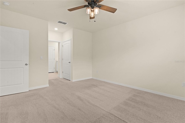 carpeted empty room with ceiling fan