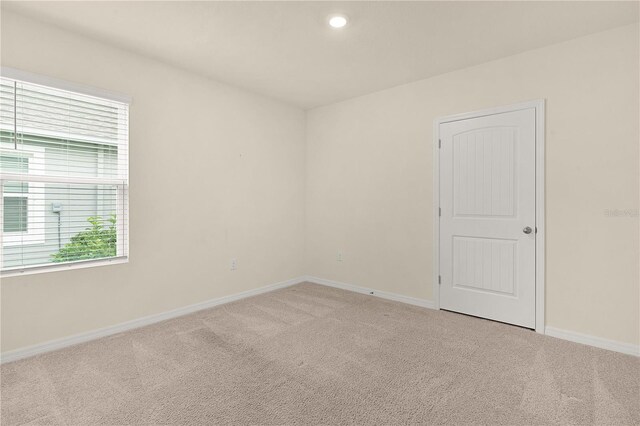 unfurnished room with carpet flooring