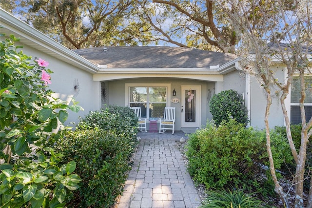 entrance to property featuring covered porch