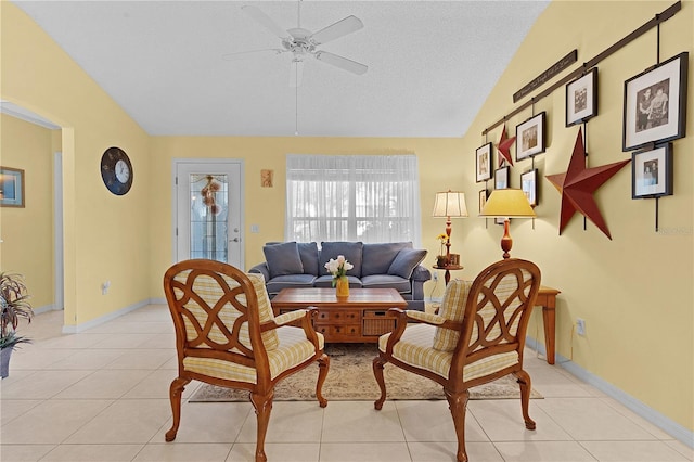 tiled living room featuring vaulted ceiling, a textured ceiling, and ceiling fan