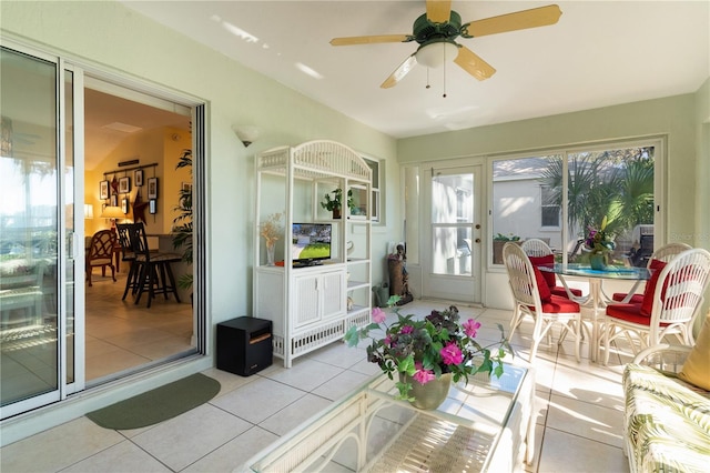 sunroom / solarium with vaulted ceiling and ceiling fan