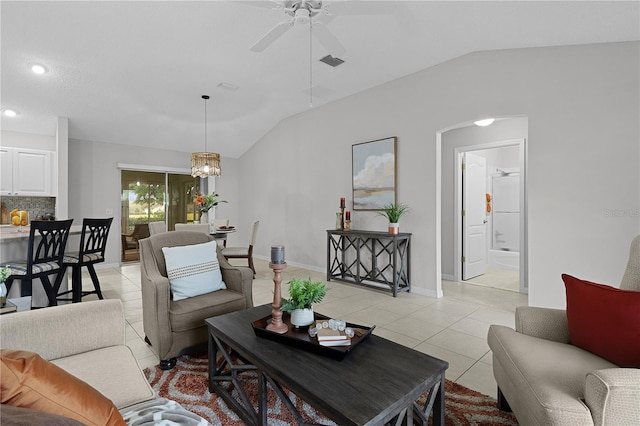 living room featuring visible vents, vaulted ceiling, light tile patterned floors, ceiling fan with notable chandelier, and arched walkways