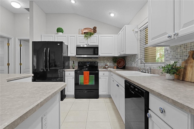 kitchen featuring black appliances, a sink, white cabinets, light countertops, and light tile patterned floors