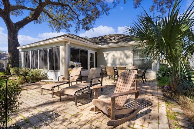 view of patio / terrace with a sunroom