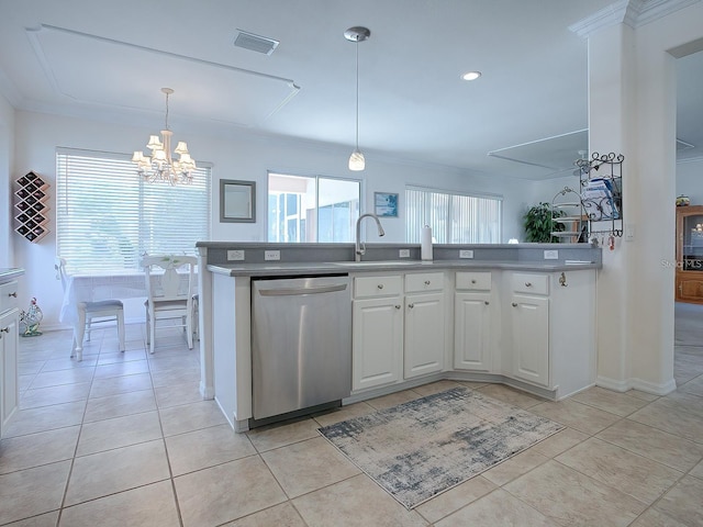 kitchen featuring stainless steel dishwasher, sink, white cabinets, and pendant lighting