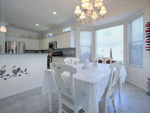 dining area featuring crown molding, light tile patterned flooring, and a notable chandelier