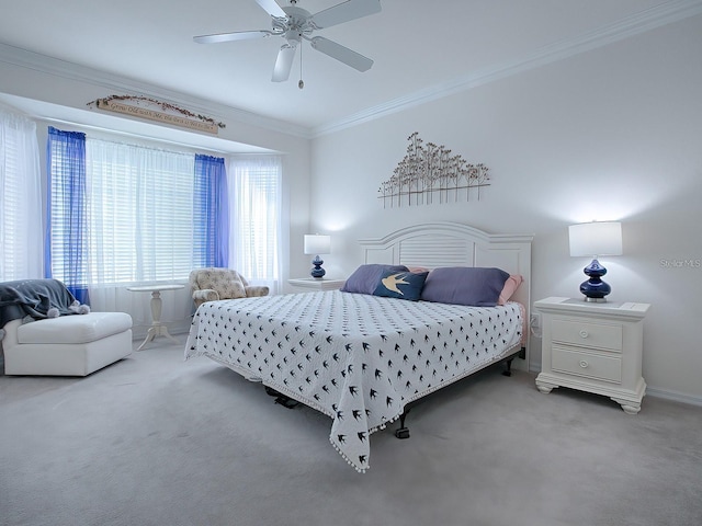 carpeted bedroom with crown molding and ceiling fan