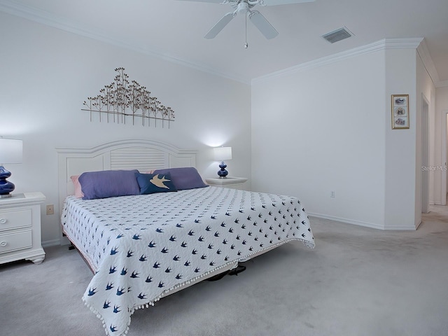 bedroom with ornamental molding, carpet, and ceiling fan