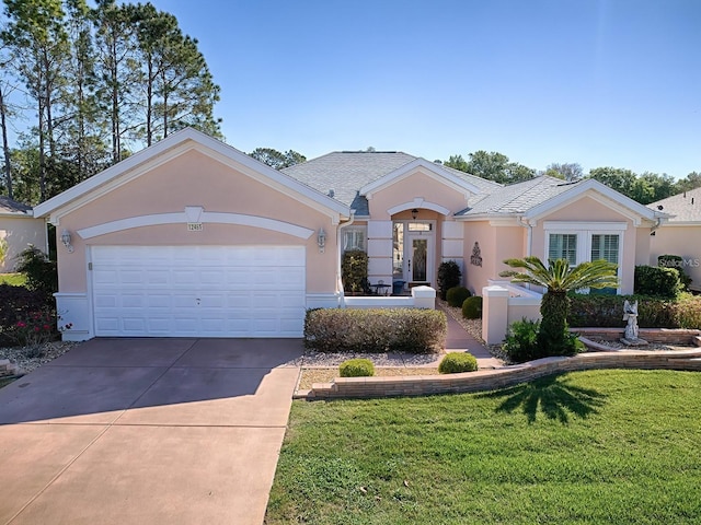 ranch-style house featuring a front lawn and a garage