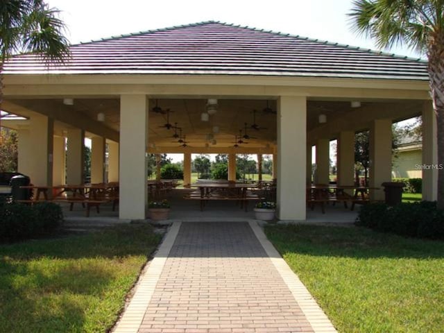 view of community featuring a gazebo, a lawn, and a patio area