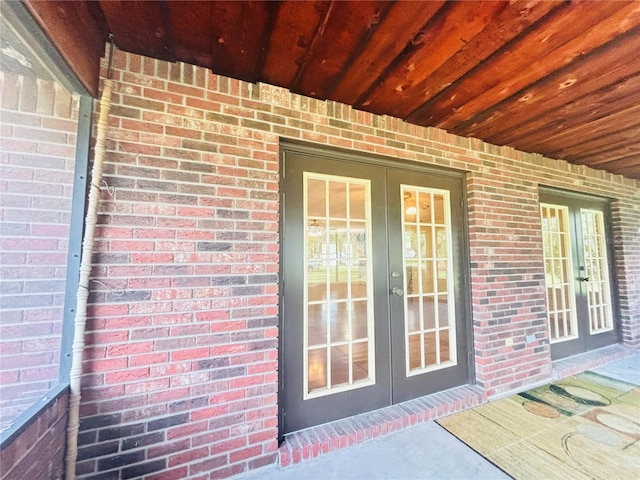 property entrance featuring french doors