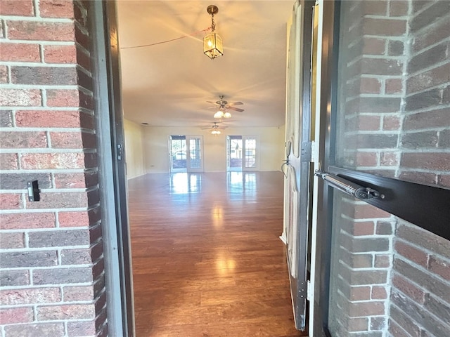 entrance to property featuring ceiling fan