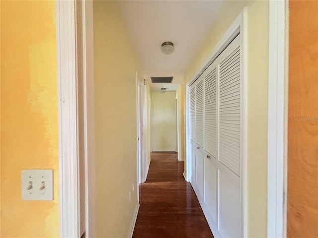 corridor featuring dark wood-type flooring