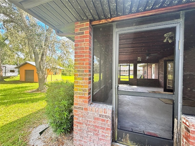 entrance to property with a yard