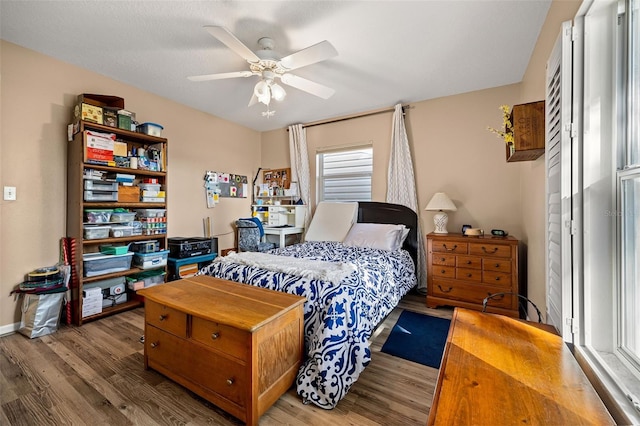 bedroom with hardwood / wood-style flooring and ceiling fan