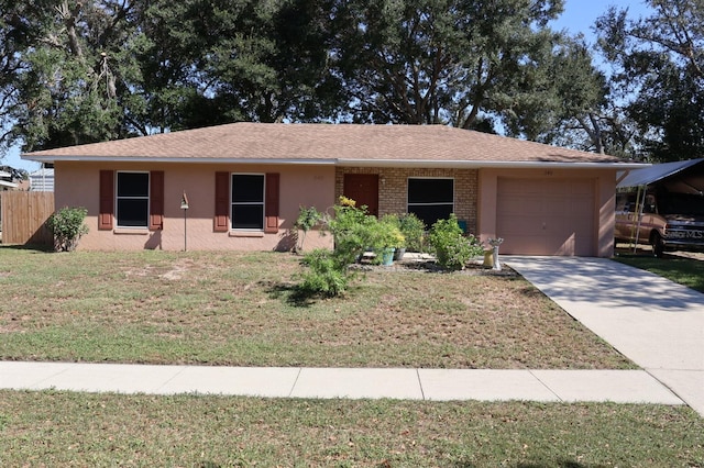 ranch-style house featuring a front yard and a garage