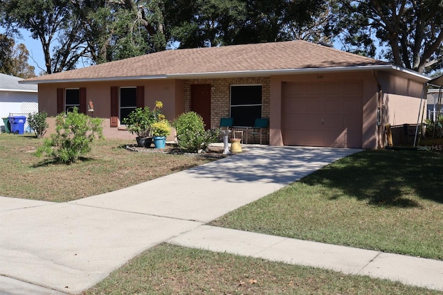 single story home featuring a garage and a front lawn