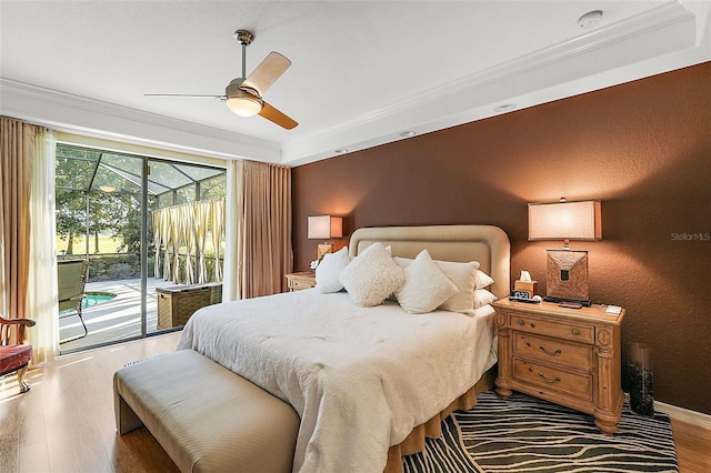 bedroom with ceiling fan, crown molding, wood-type flooring, and access to exterior