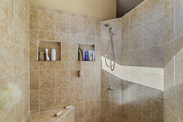 bathroom with tiled shower