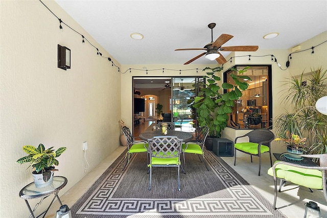 exterior space featuring ceiling fan