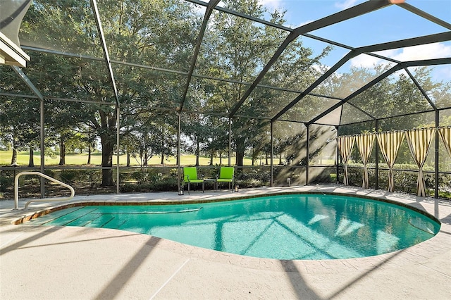 view of swimming pool with a patio area and glass enclosure