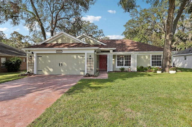 ranch-style home featuring a front lawn and a garage