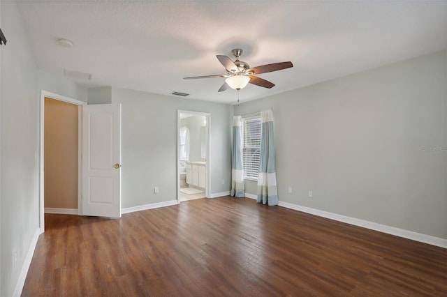 spare room with ceiling fan, dark hardwood / wood-style flooring, and a textured ceiling