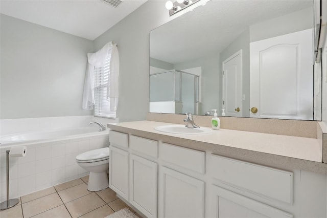 full bathroom with tile patterned floors, vanity, separate shower and tub, and toilet