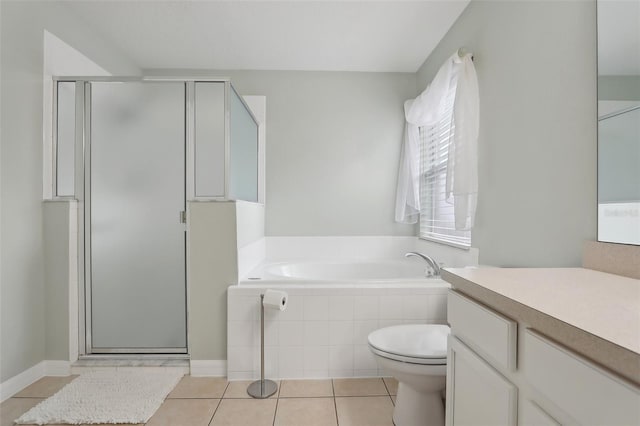 full bathroom featuring plus walk in shower, vanity, tile patterned floors, and toilet