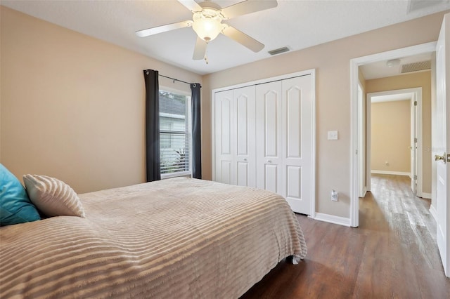 bedroom with ceiling fan, a closet, and wood-type flooring