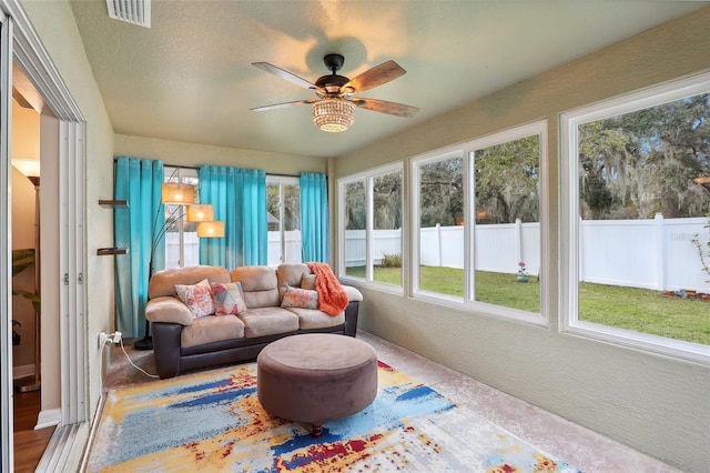 sunroom with ceiling fan