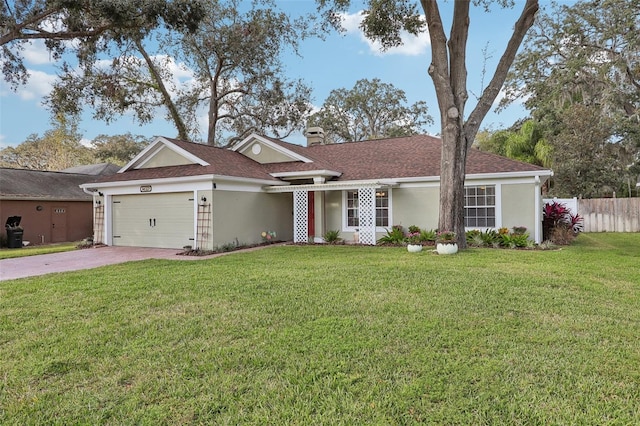 ranch-style home with a front yard and a garage