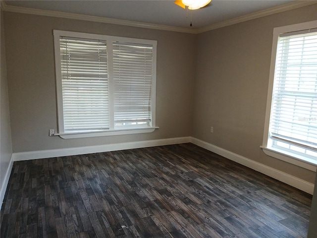 spare room with crown molding, dark hardwood / wood-style floors, and ceiling fan