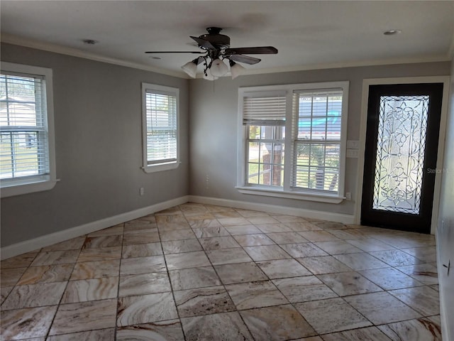 entryway featuring ornamental molding and ceiling fan